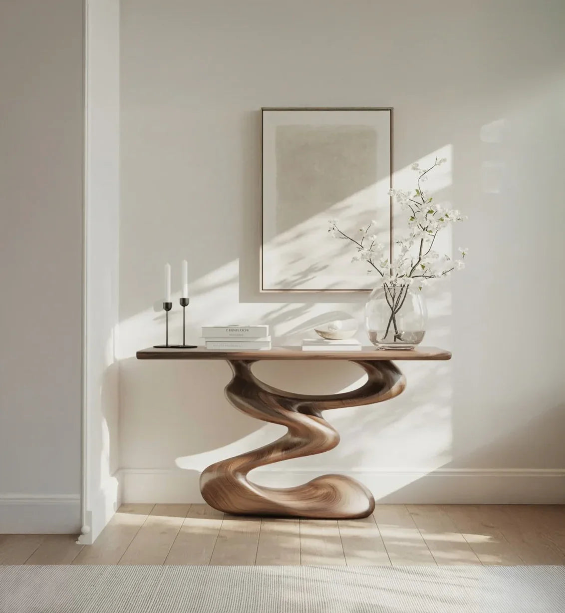 Modern sculptural wood console table in sunlit room with minimalist decor and framed art