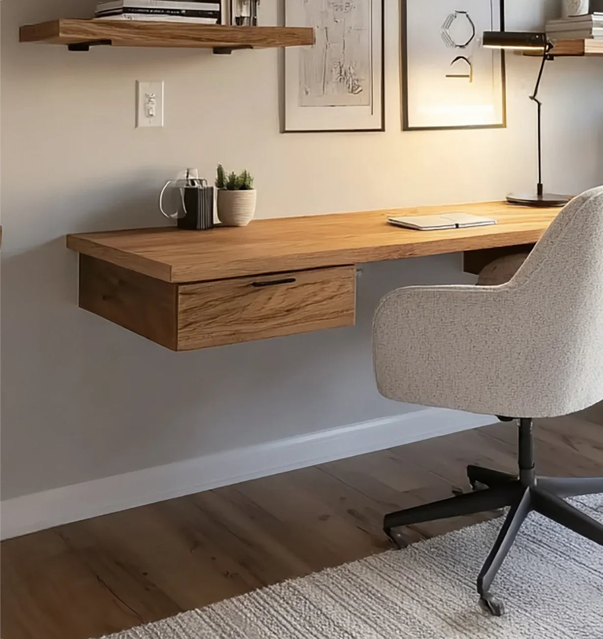 Floating solid wood desk with drawer, modern office chair, and wall shelves in minimalist home office. floating desk FAQ installation height cable management details