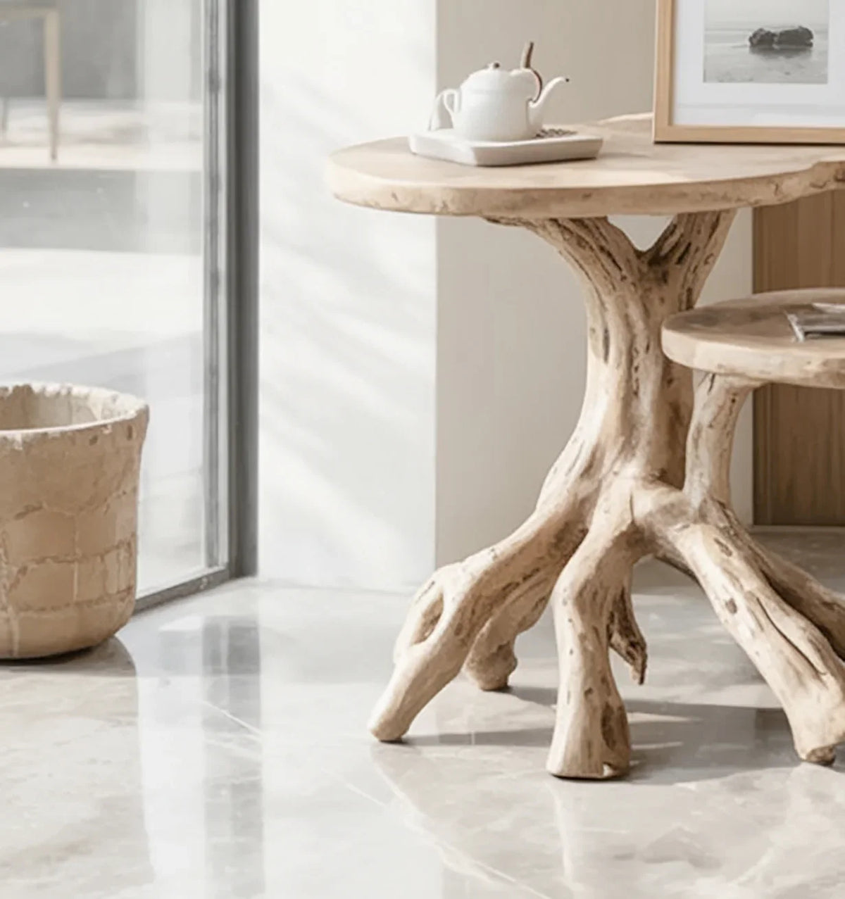 Live edge solid wood table with tree root base in a modern sunlit living room