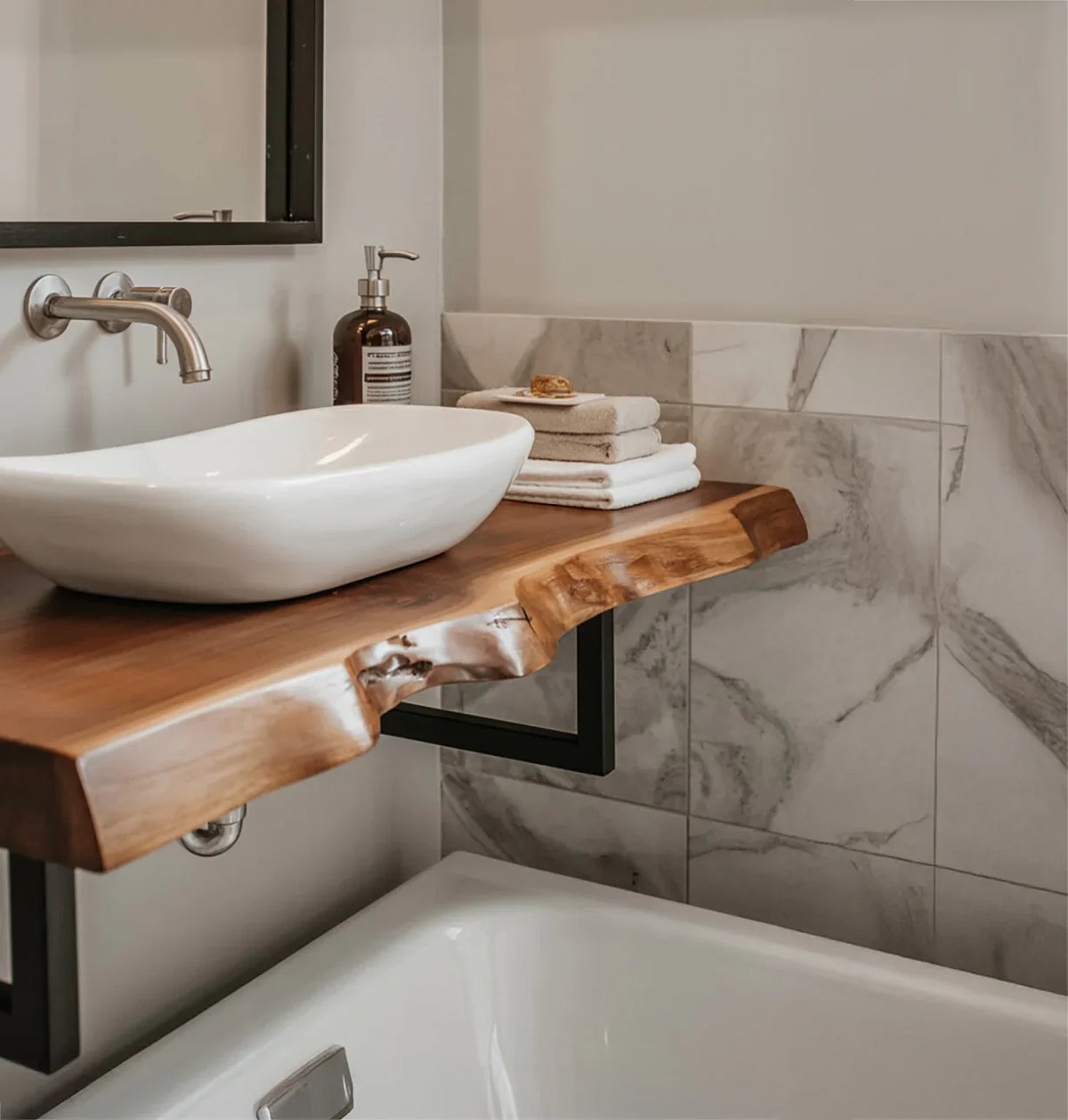Live edge wood floating bathroom vanity with vessel sink and marble tile wall