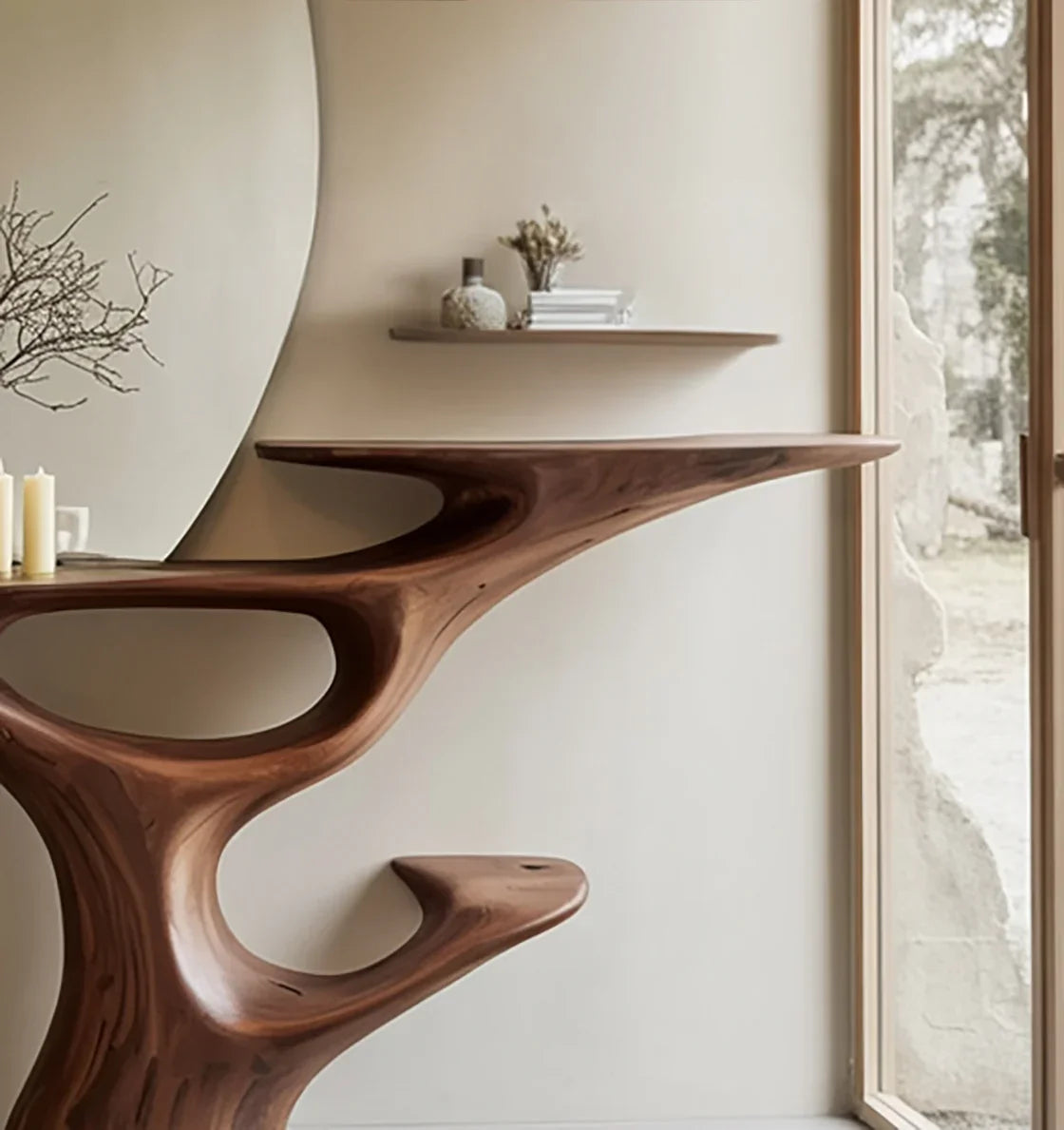 Organic sculpted solid wood console table in modern entryway with floating shelf