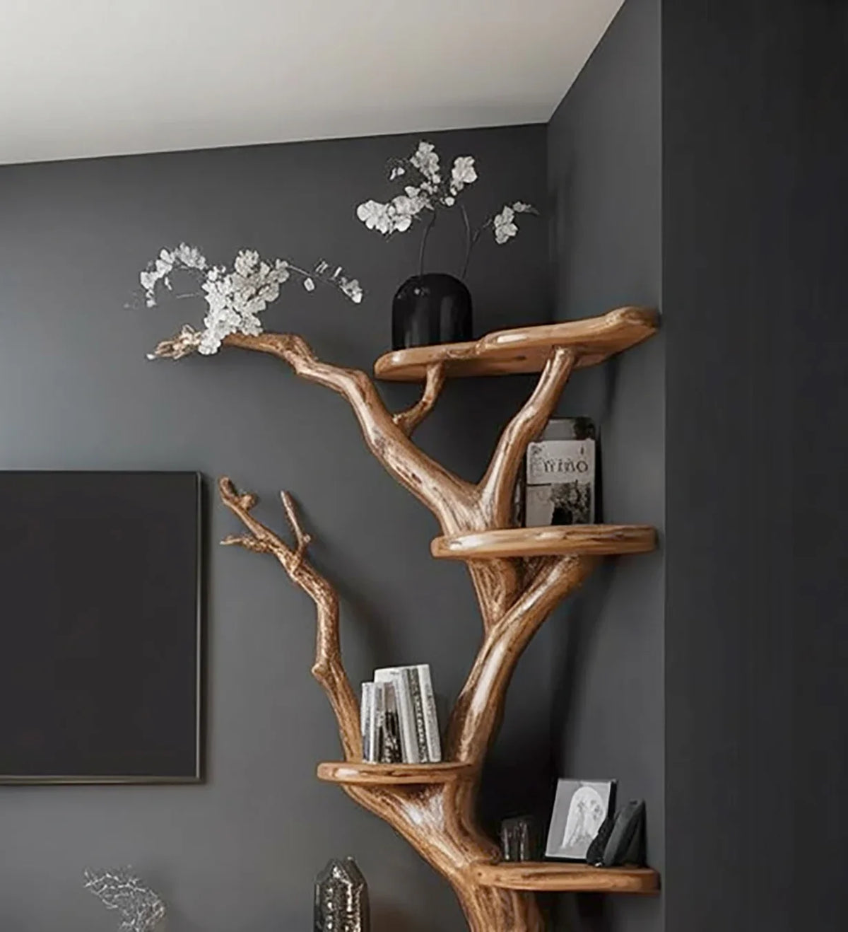 Live edge tree bookshelf with solid wood shelves, modern decor, books and vase display
