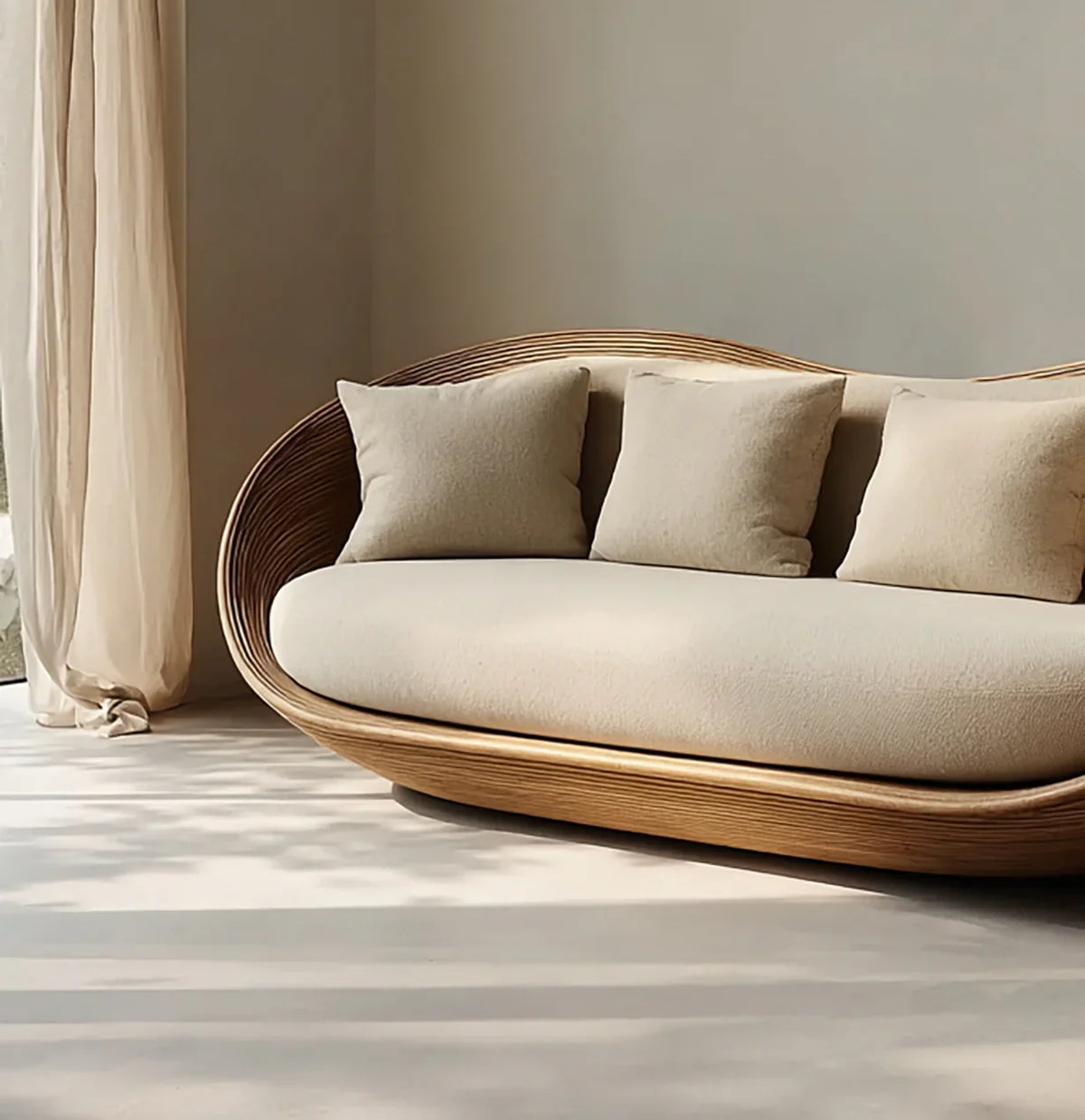 Modern curved wooden frame sofa with beige cushions in bright minimalist room