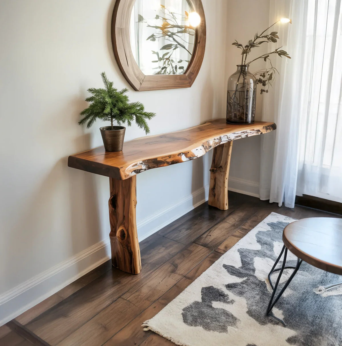 Live edge solid wood console table in modern entryway with round mirror and potted plants