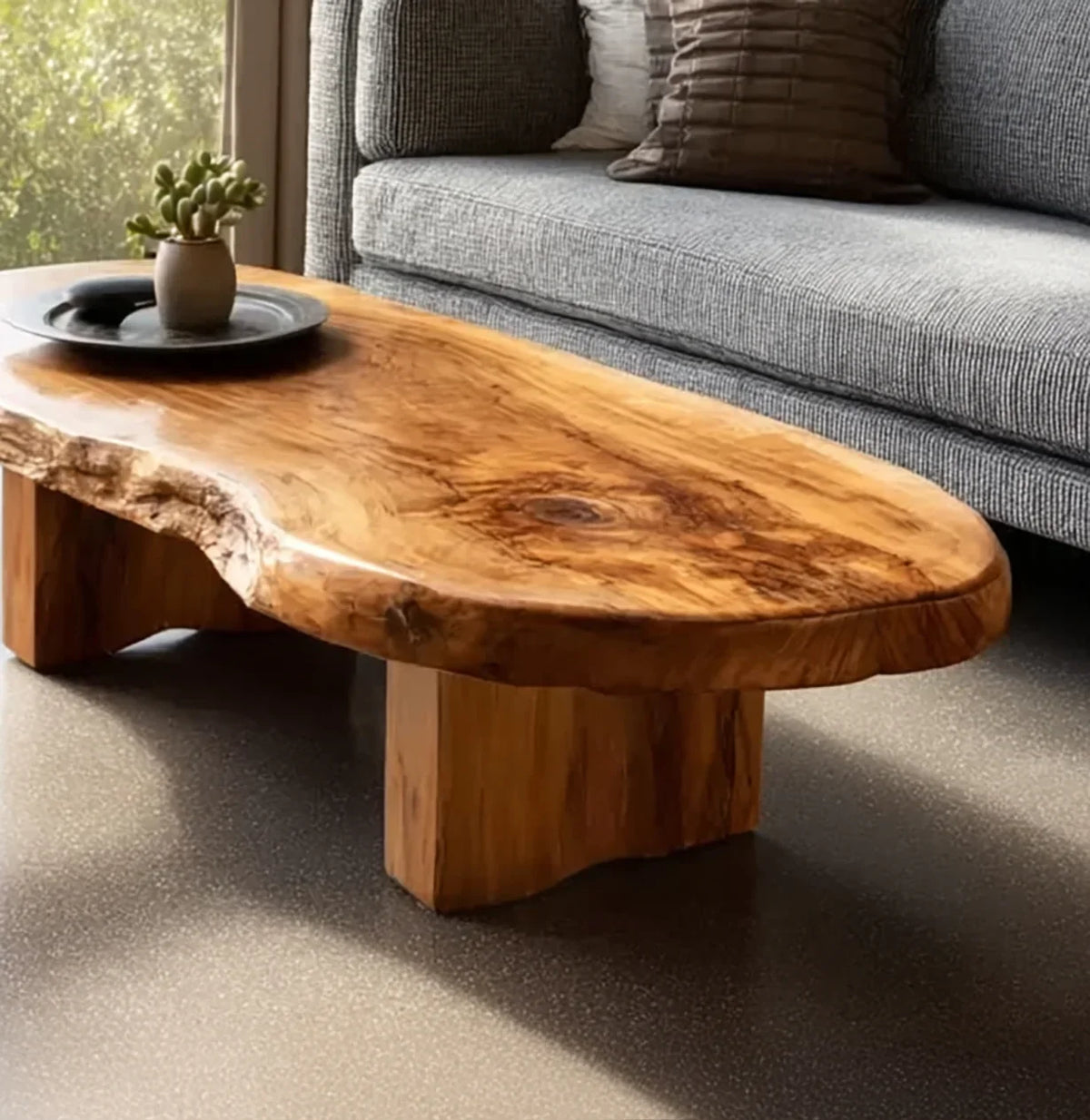 Live edge solid wood coffee table with natural grain in modern living room setting.