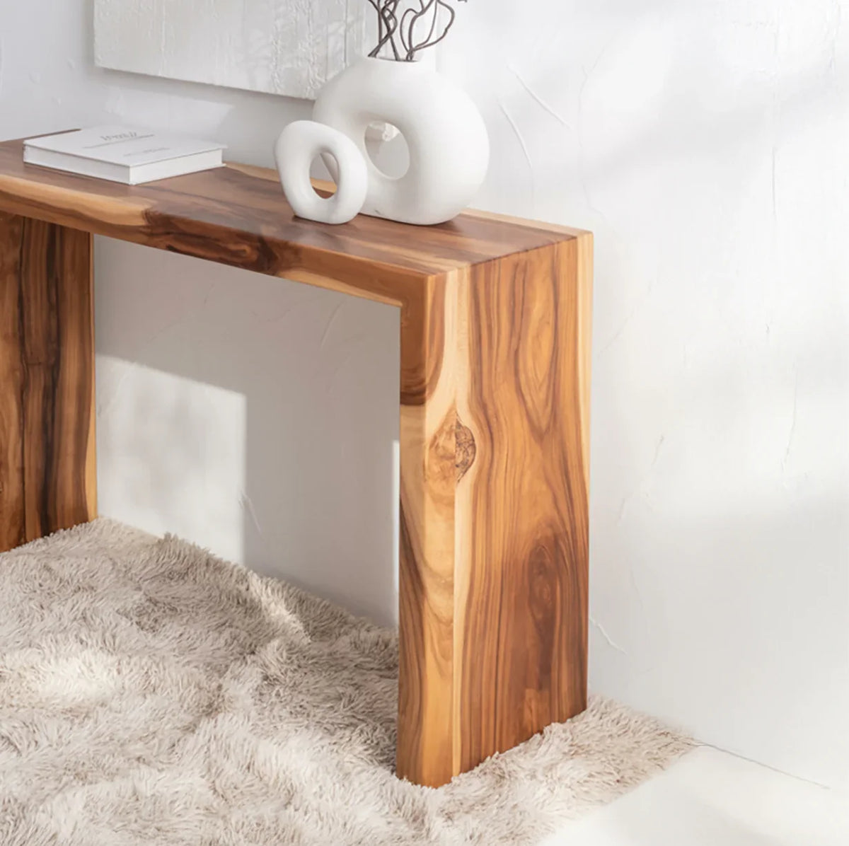 Solid wood modern console table with live edge design in a bright, minimal living space