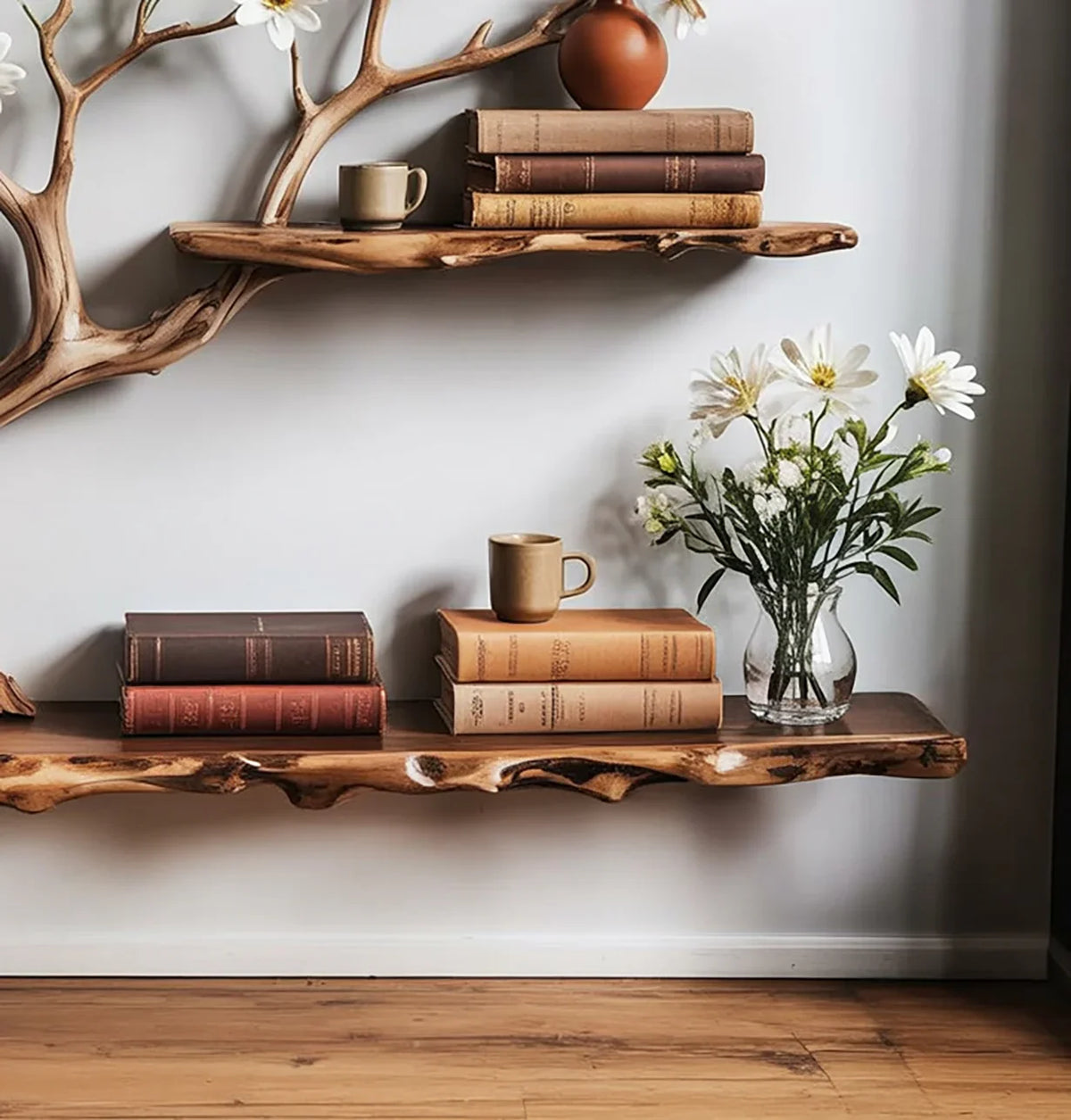 Live edge floating wood shelves with books, mugs, vase of flowers, and tree branch design