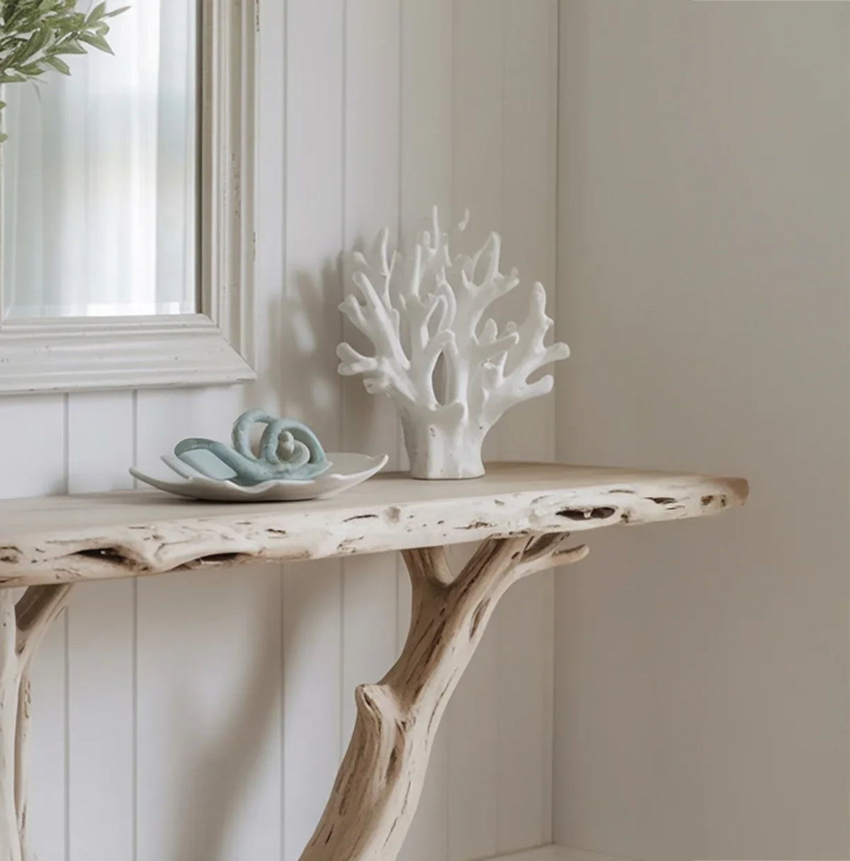 Rustic live edge wood console table with tree branch legs and coastal decor accents