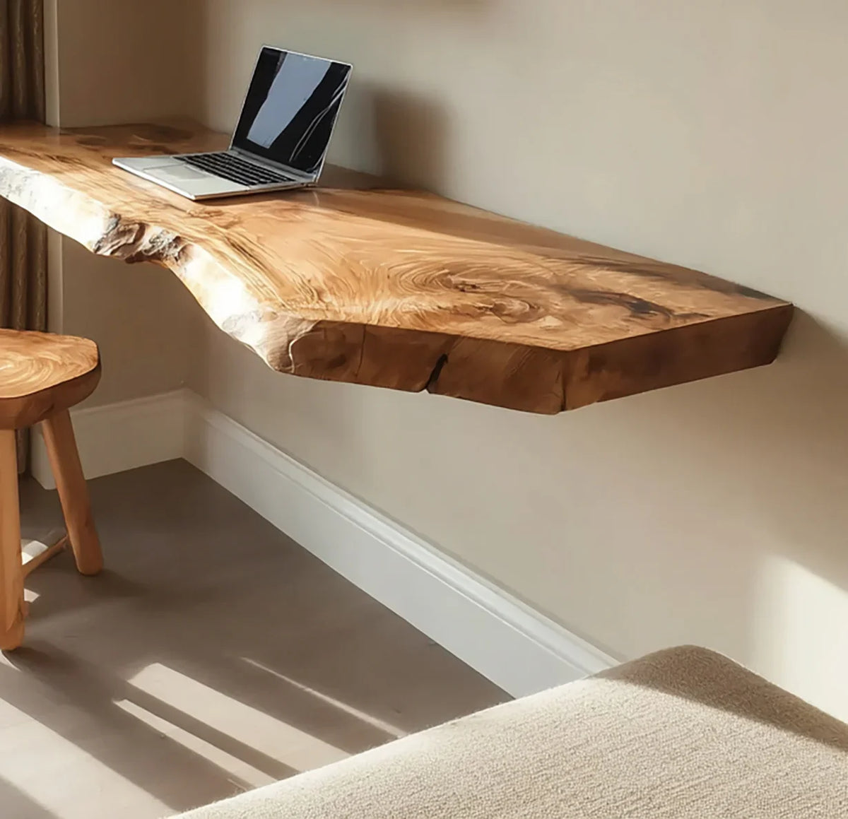 Live edge floating wood desk with laptop, matching wooden stool, modern minimalist room
