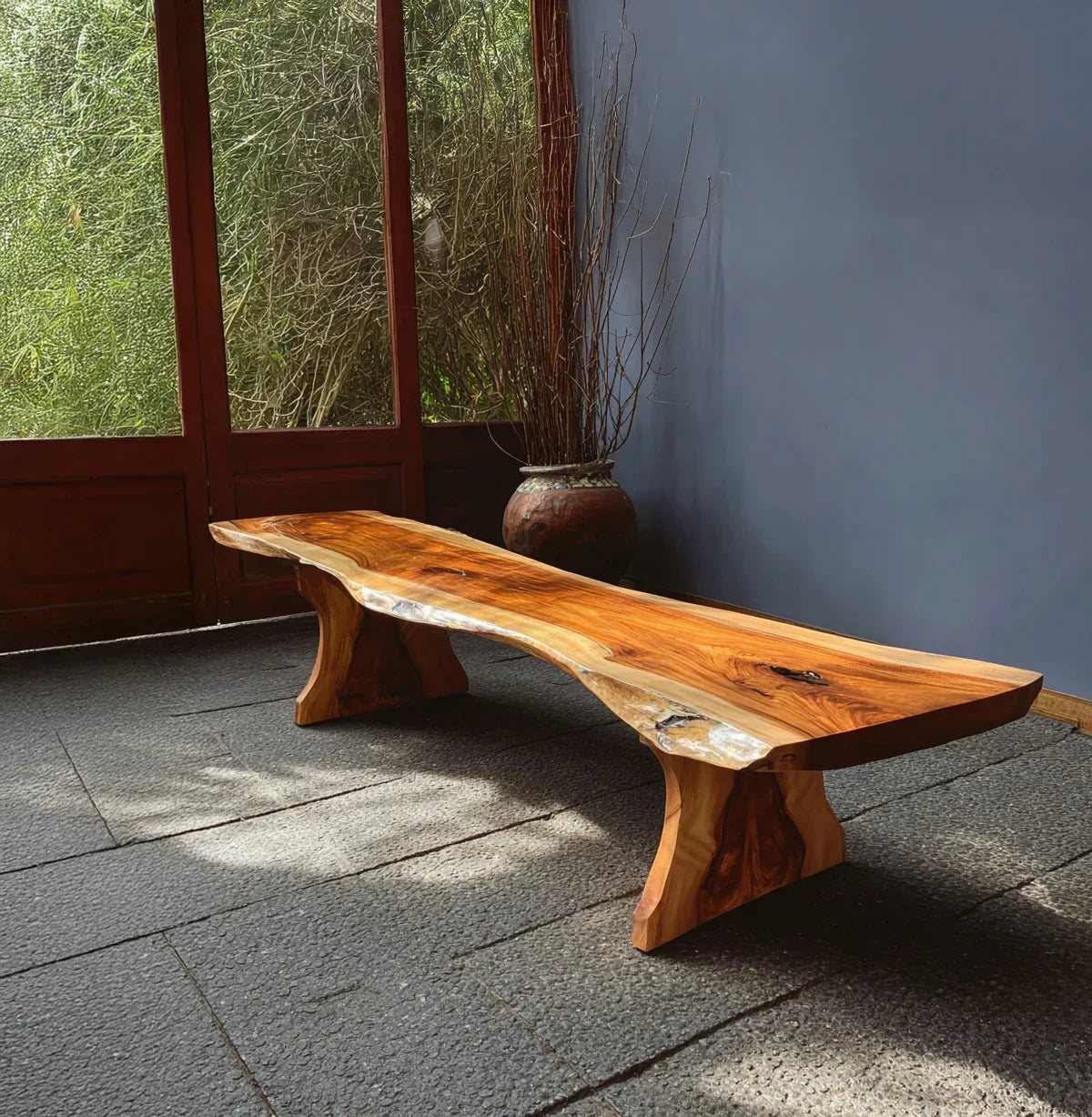 Live edge solid wood bench with natural finish in a modern, sunlit room