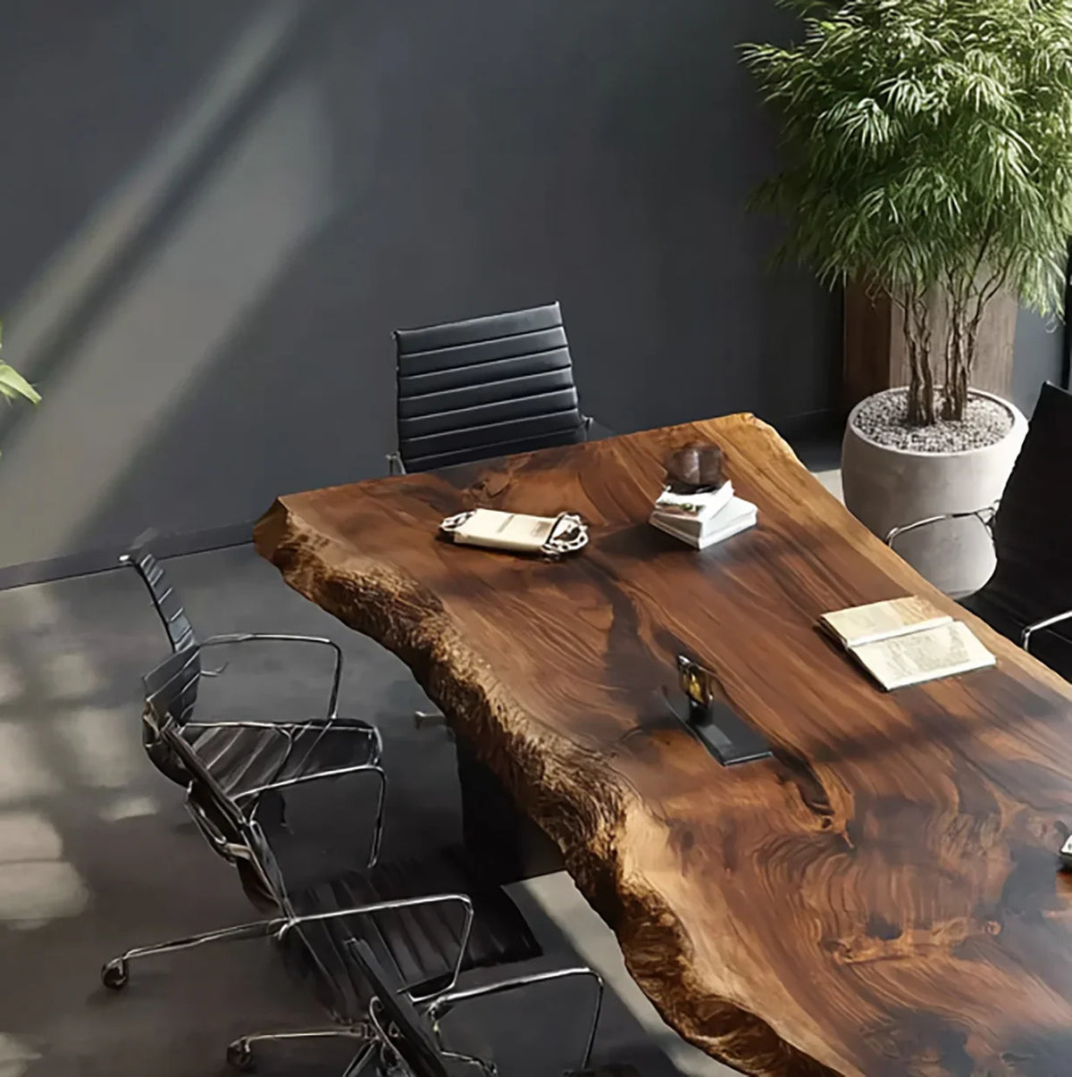 Live edge solid wood conference table with black chairs in a modern office setting