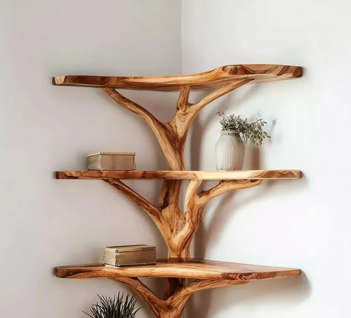Live edge solid wood tree bookshelf with floating shelves in a corner, holding books and a vase