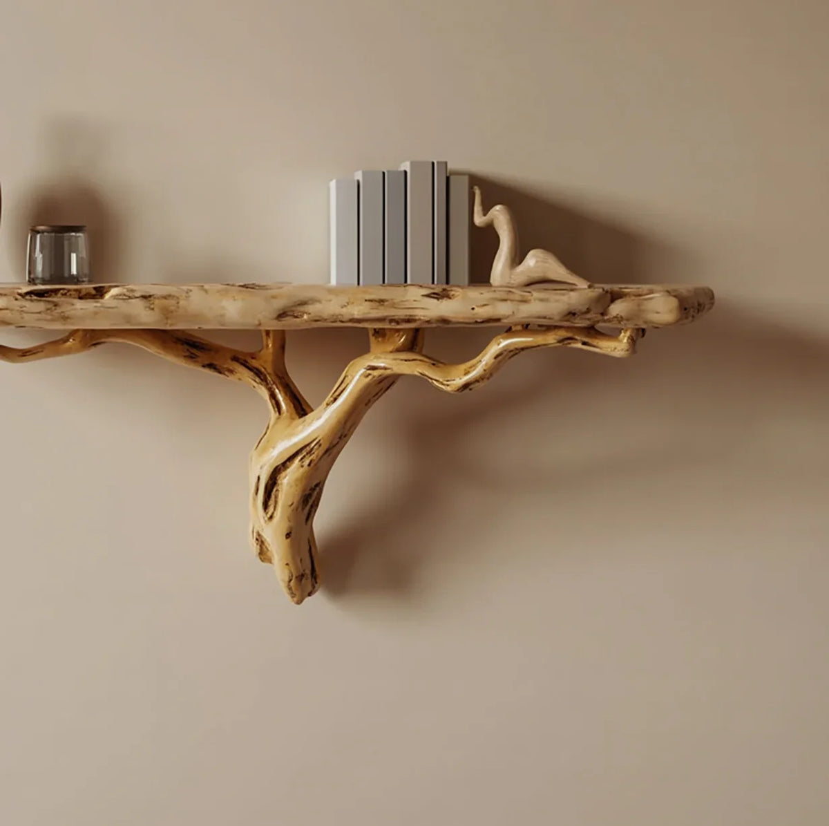 Live edge wooden floating shelf with natural branch support, books, and decor on beige wall