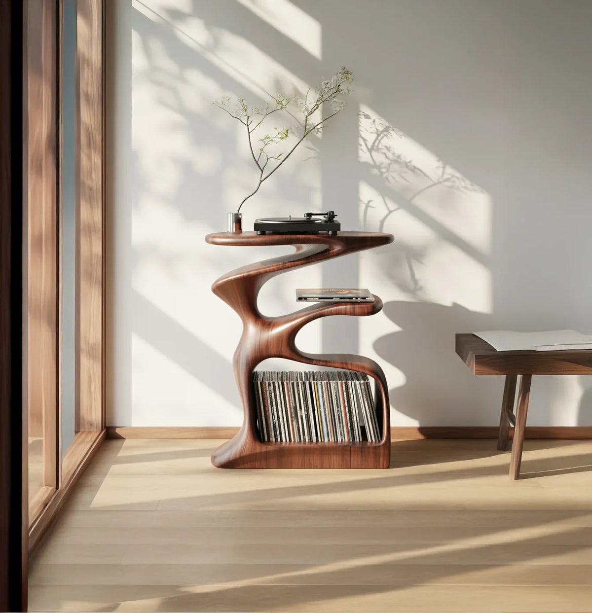 Modern sculptural solid wood shelf with vinyl records, turntable, and minimalist decor in sunlight.