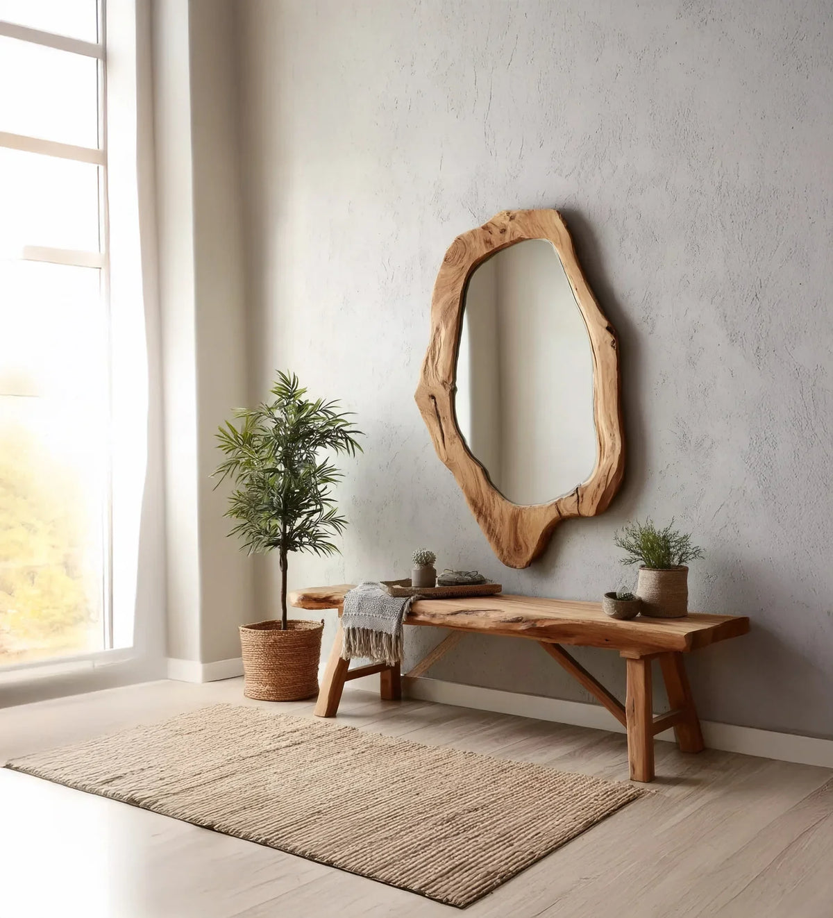 Natural wood bench and organic-shaped mirror on textured wall with potted plants in bright room