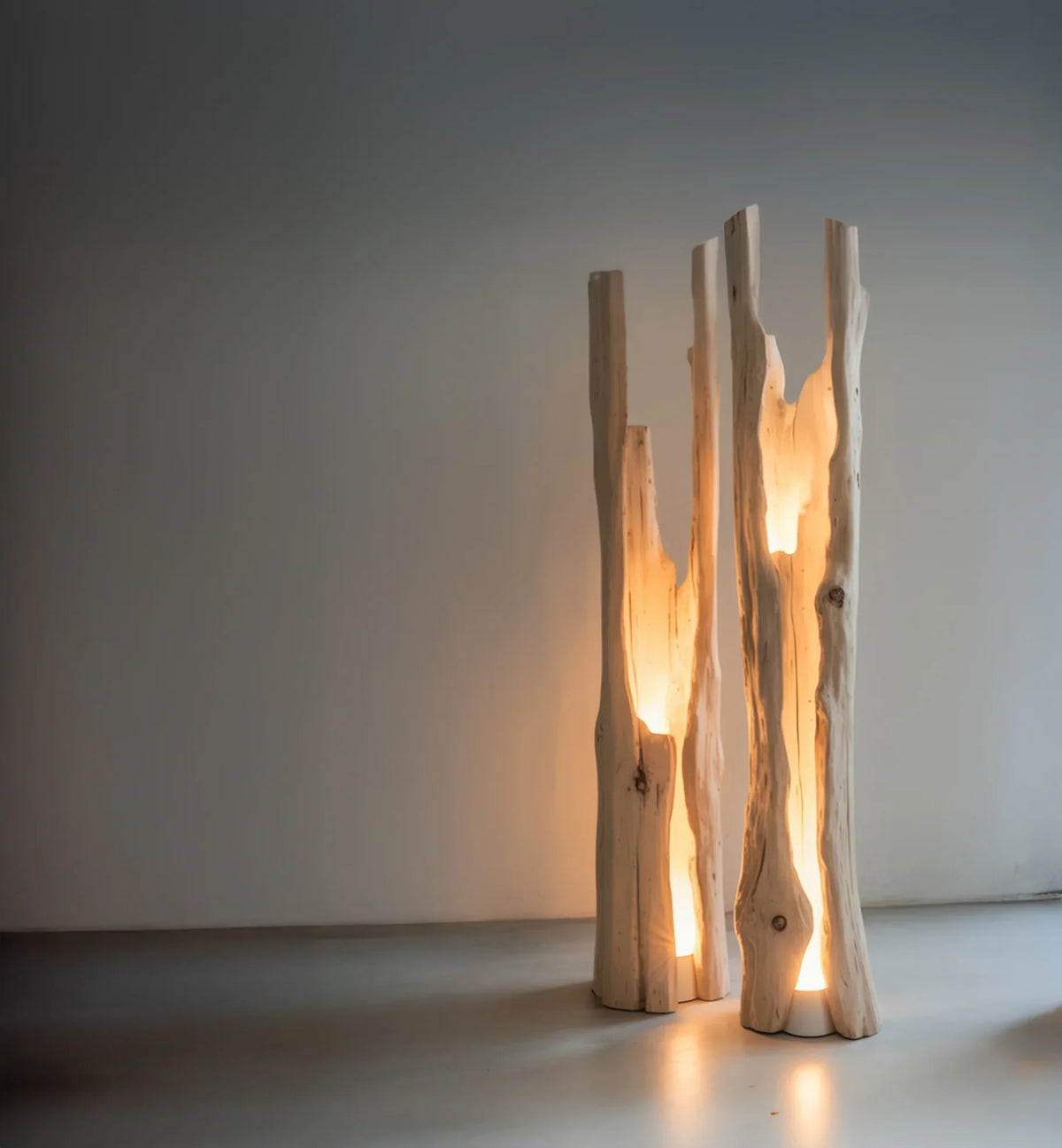 Modern floor lamp with carved wooden beams emitting warm ambient light in minimalist room