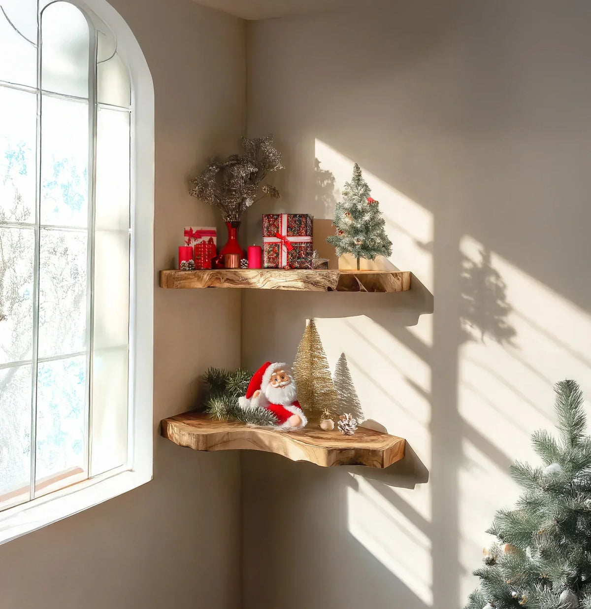 Live edge wood floating shelves with Christmas decor and gifts by a sunlit window.