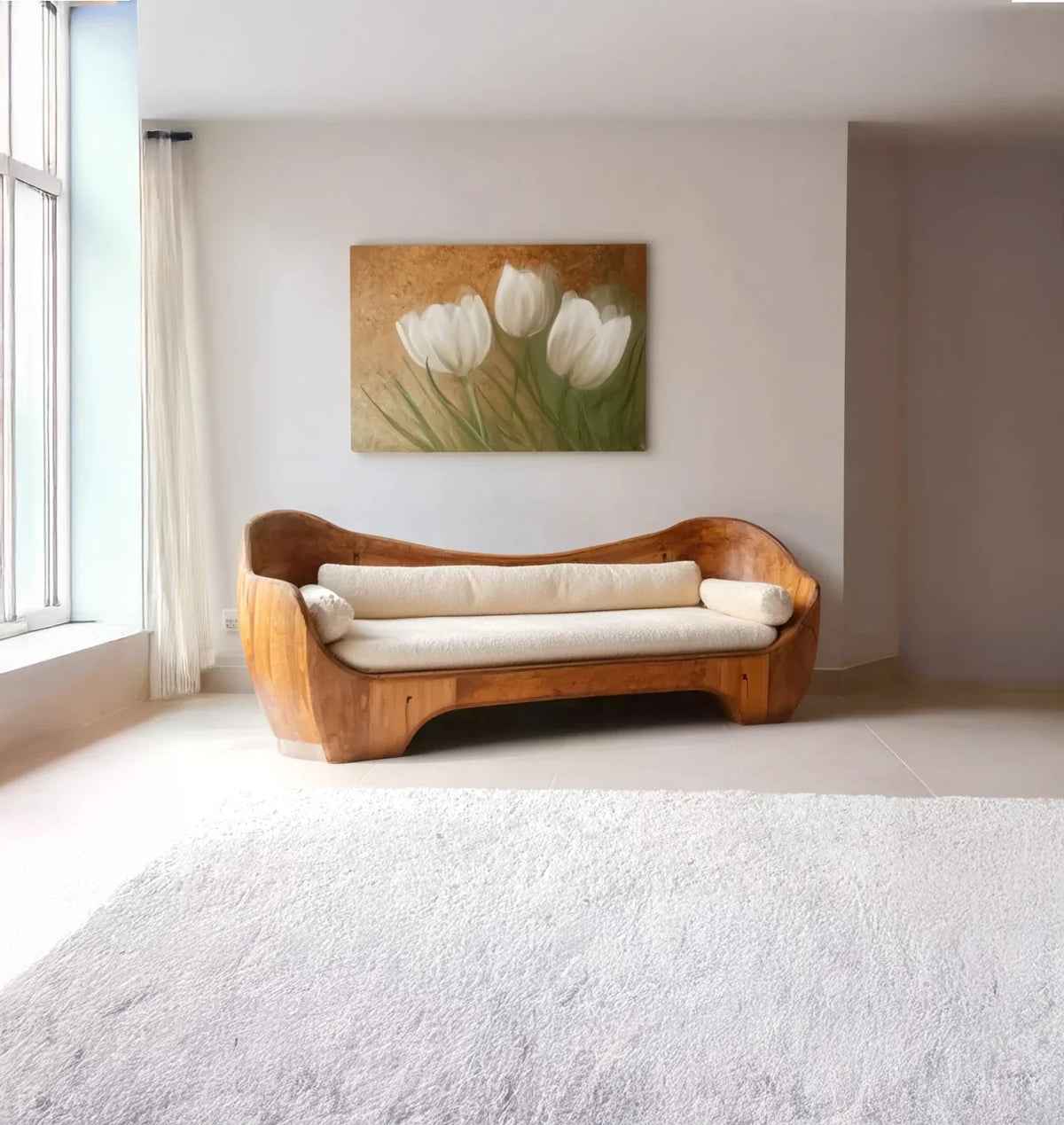 Minimalist living room with wooden sofa, white cushions, large window, and tulip painting on wall