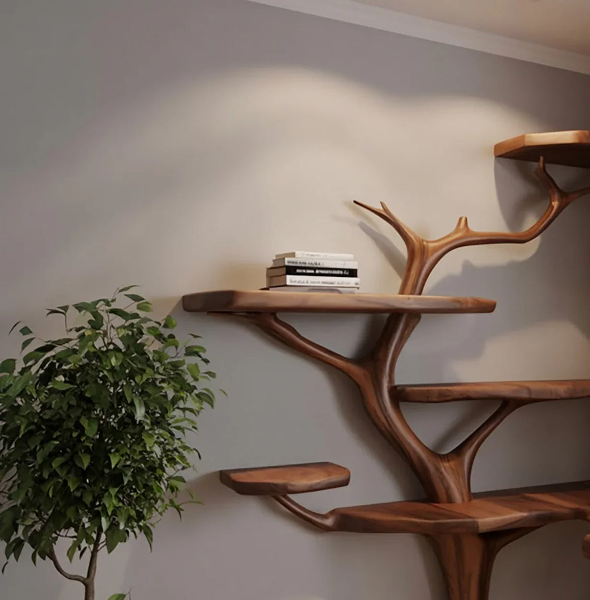 modern wooden tree-shaped wall shelves with stacked books next to a leafy green indoor plant