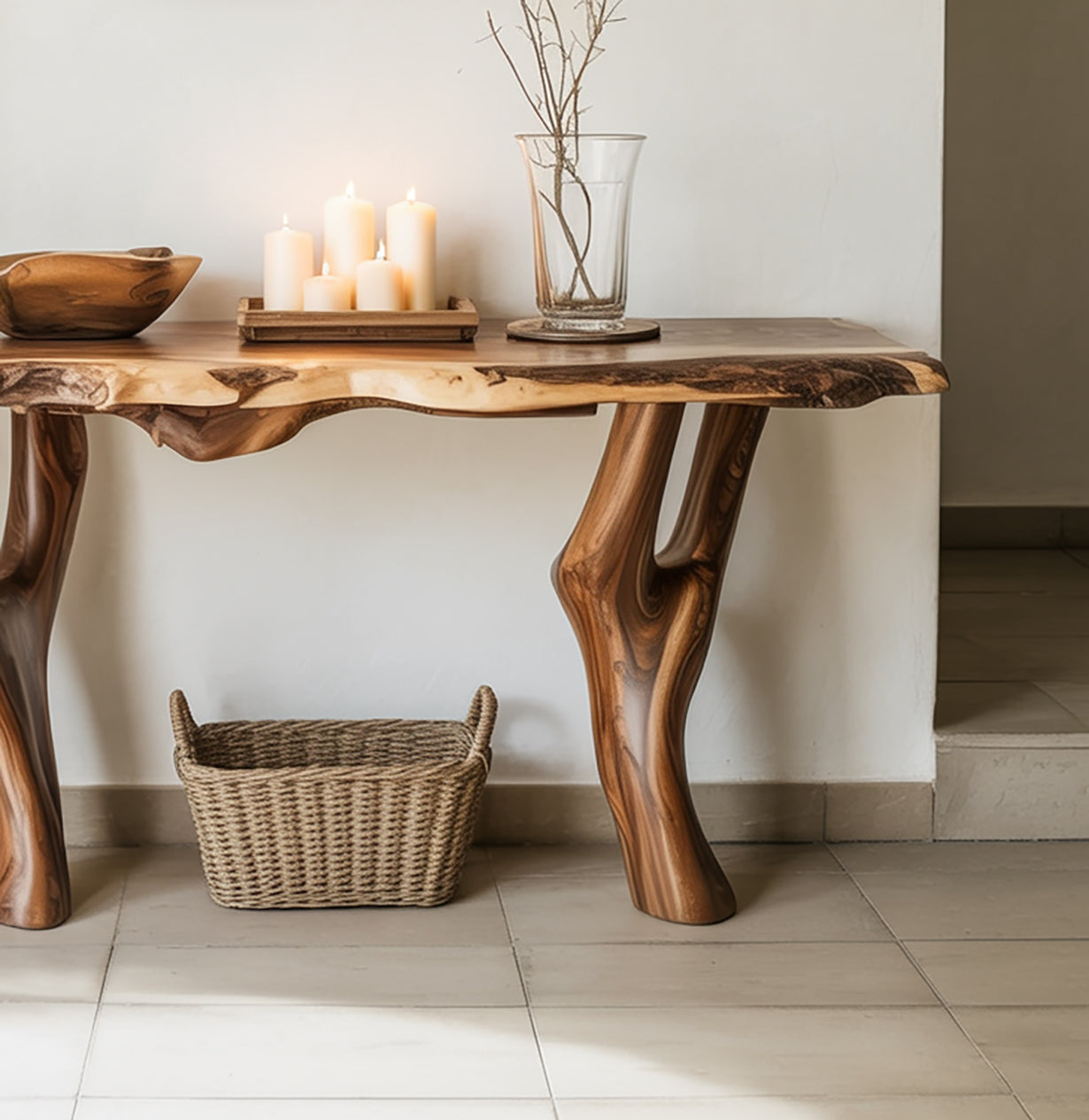 Rustic live edge wood table with lit candles, glass vase, and wicker basket in minimalist room