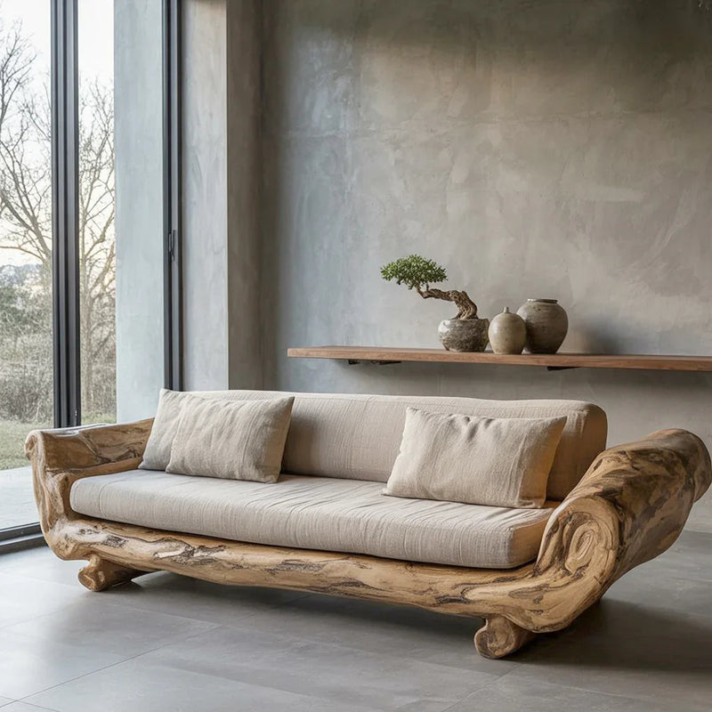 Modern living room with a natural wood frame sofa, beige cushions, and minimalist wooden shelf with pottery