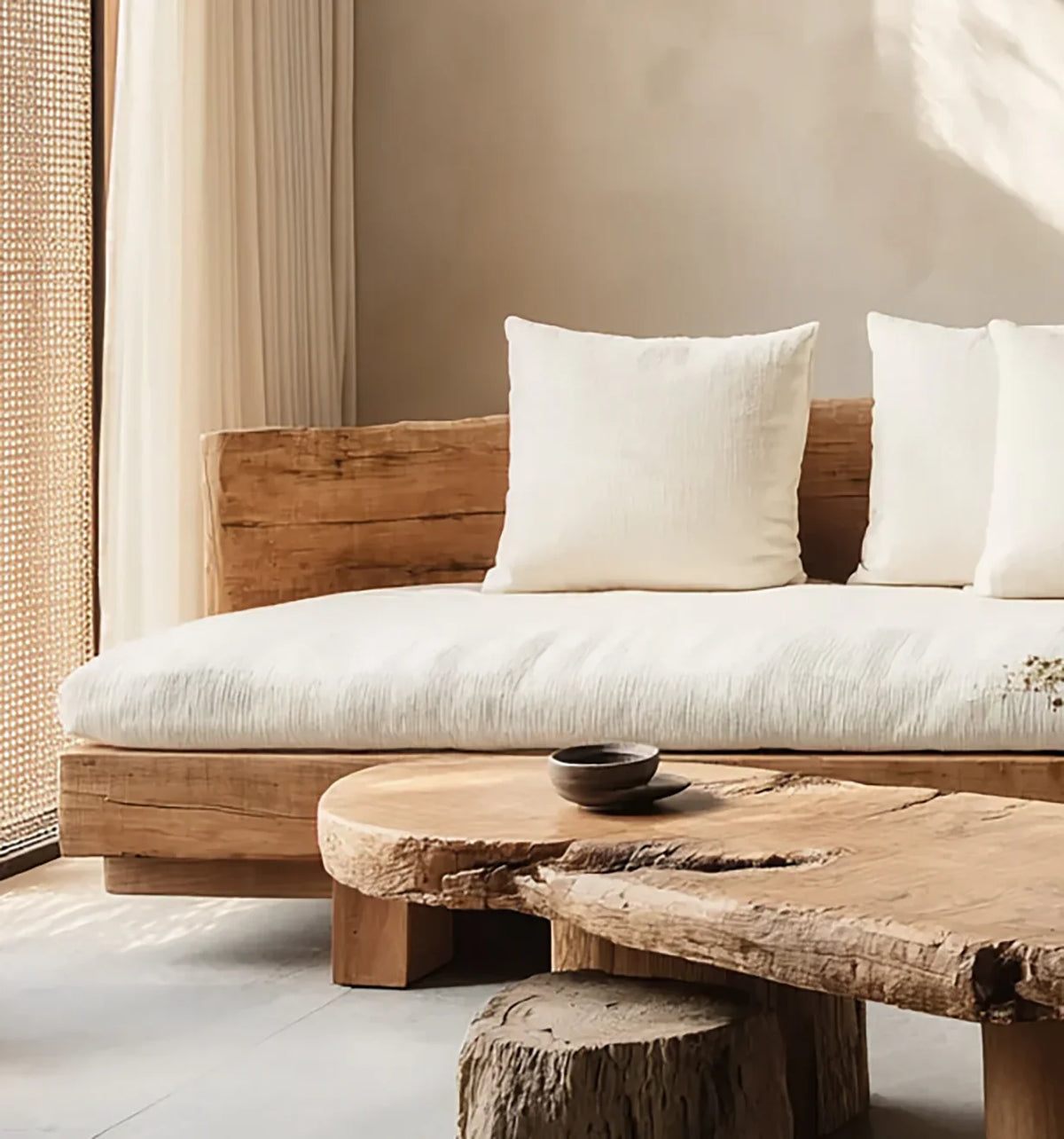 Solid wood live edge sofa and coffee table with white cushions in a minimalist room
