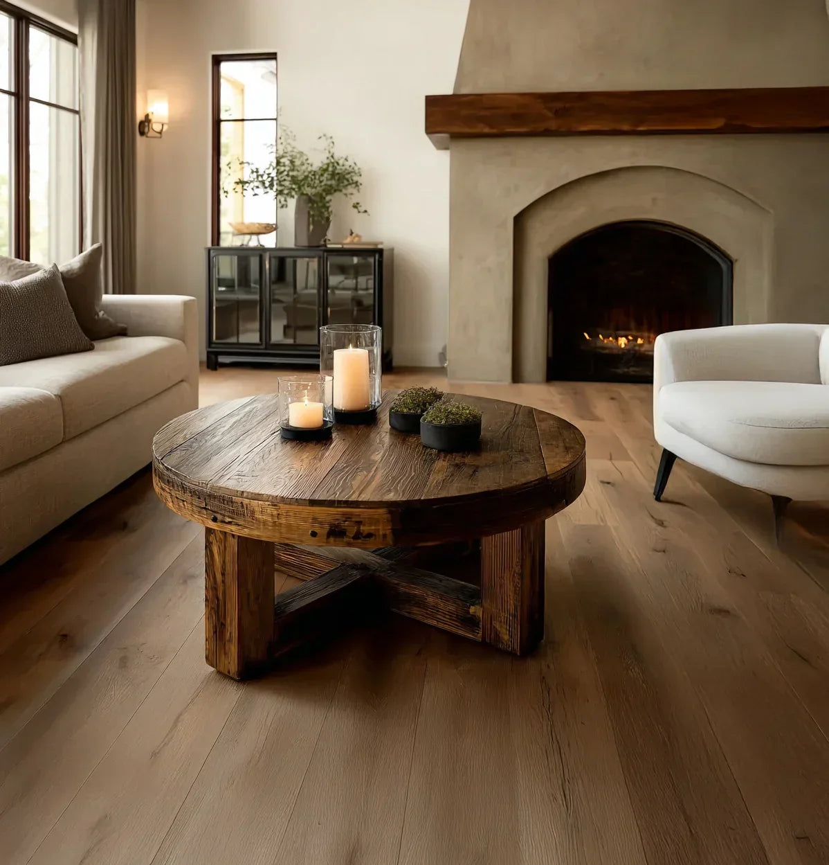 Solid wood round live edge coffee table in a cozy living room with fireplace and candles