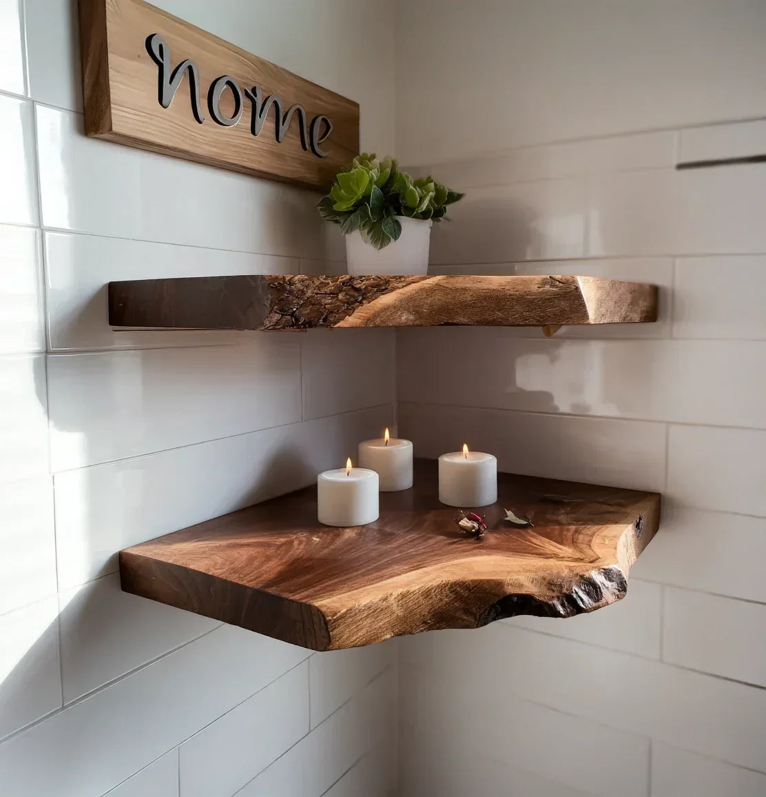 Live edge solid wood floating shelves with candles and potted plant against white tile wall