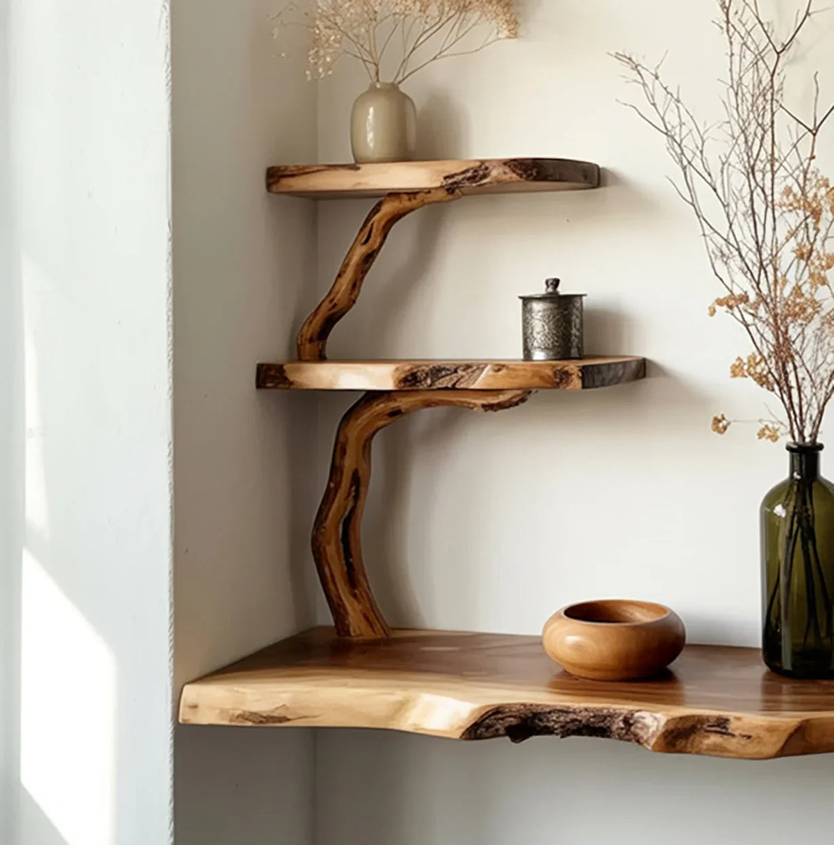 Natural wooden corner shelves with organic edges, decorated with vase, bowl, and dried plants