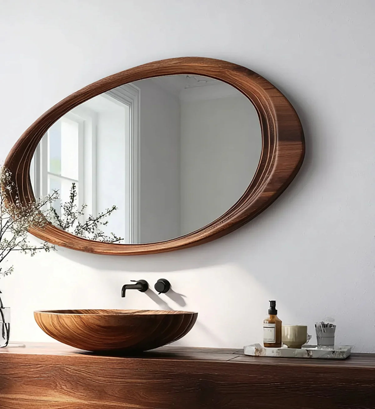 Modern bathroom with round wooden vessel sink and matching oval mirror on white wall