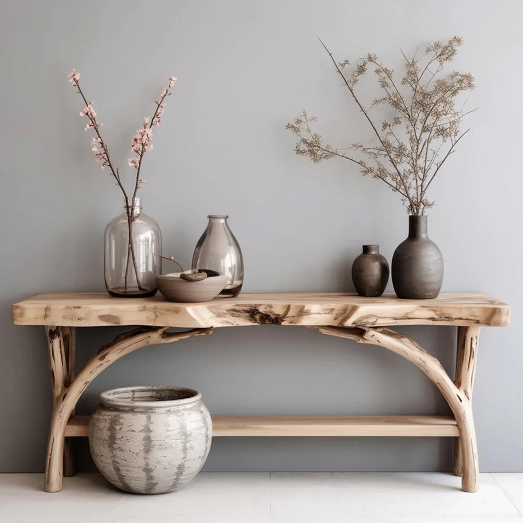 Live edge solid wood console table with natural branch legs, decorated with ceramic vases