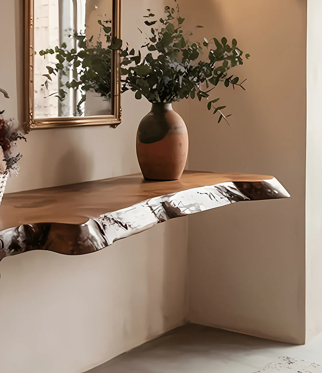 Floating wooden wall shelf with epoxy resin edge holding a ceramic vase with green eucalyptus branches
