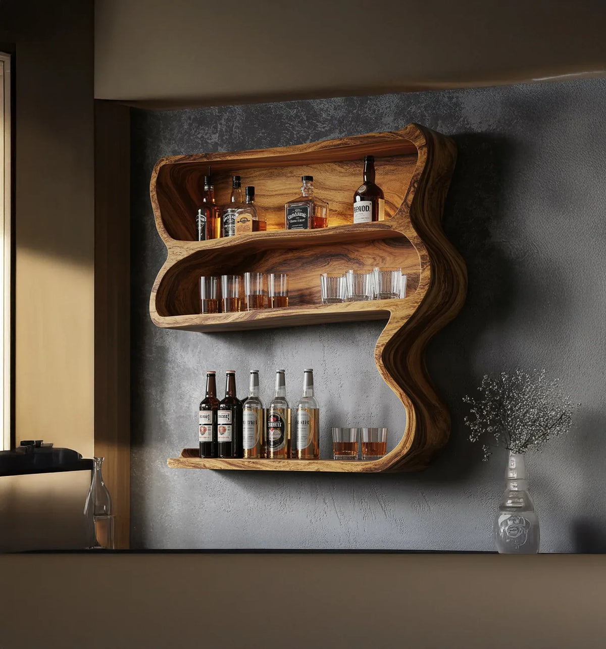 wooden wall-mounted bar shelf with liquor bottles and glasses against concrete wall