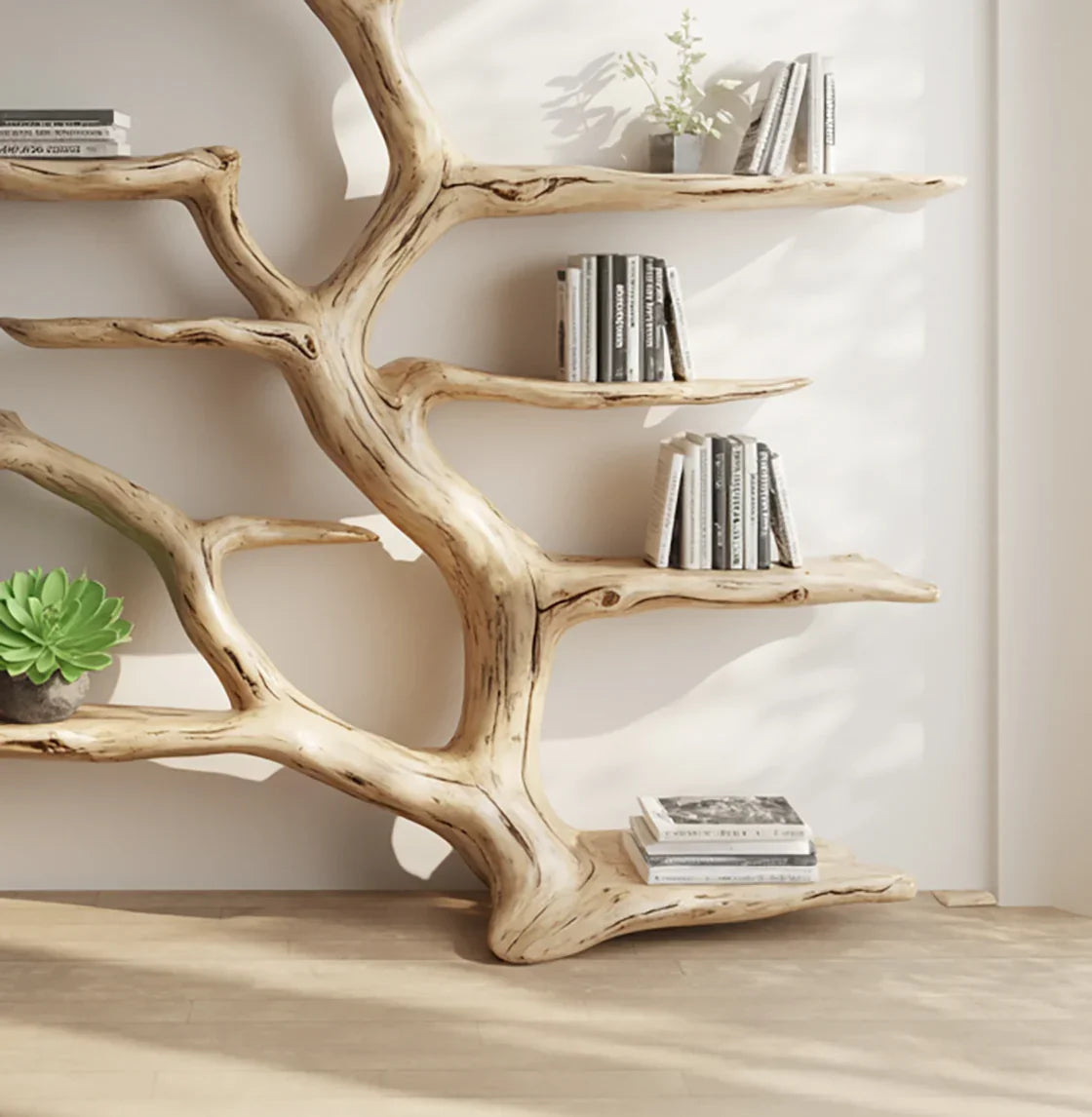 Unique tree branch bookshelf with decorative books and green plant in bright room