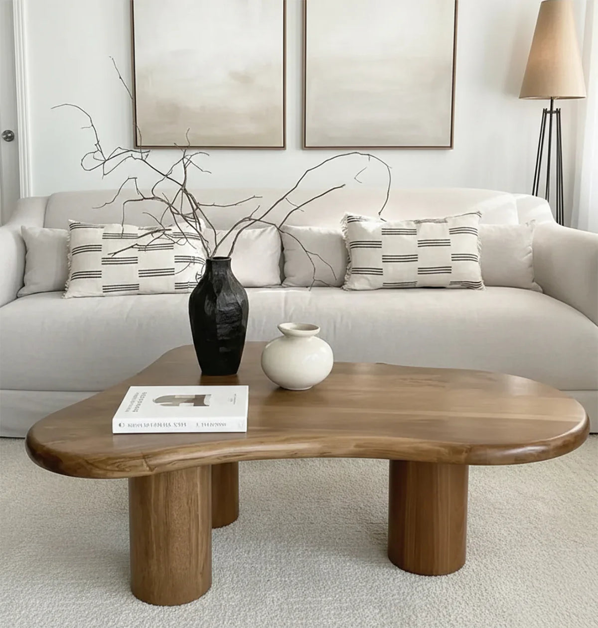 Solid wood live edge coffee table in modern living room with neutral decor and vases