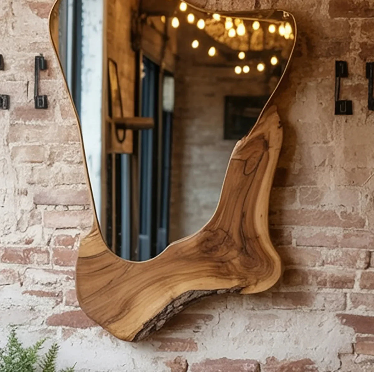 Live edge wood wall mirror with organic shape on exposed brick wall, rustic home decor