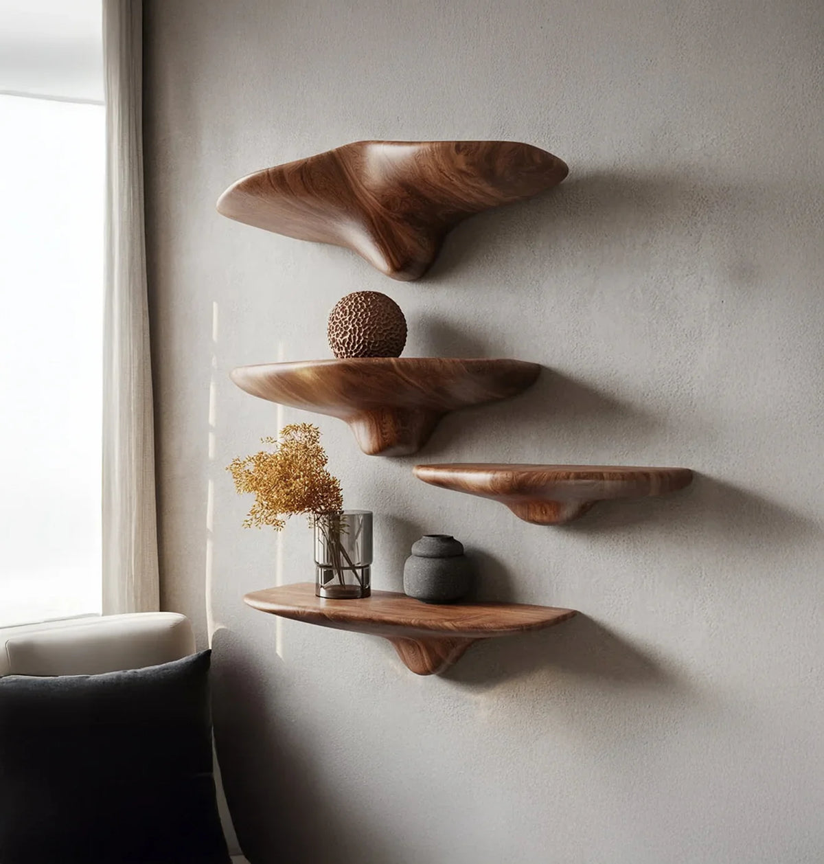 Live edge floating wooden shelves mounted on a wall with modern decor accents