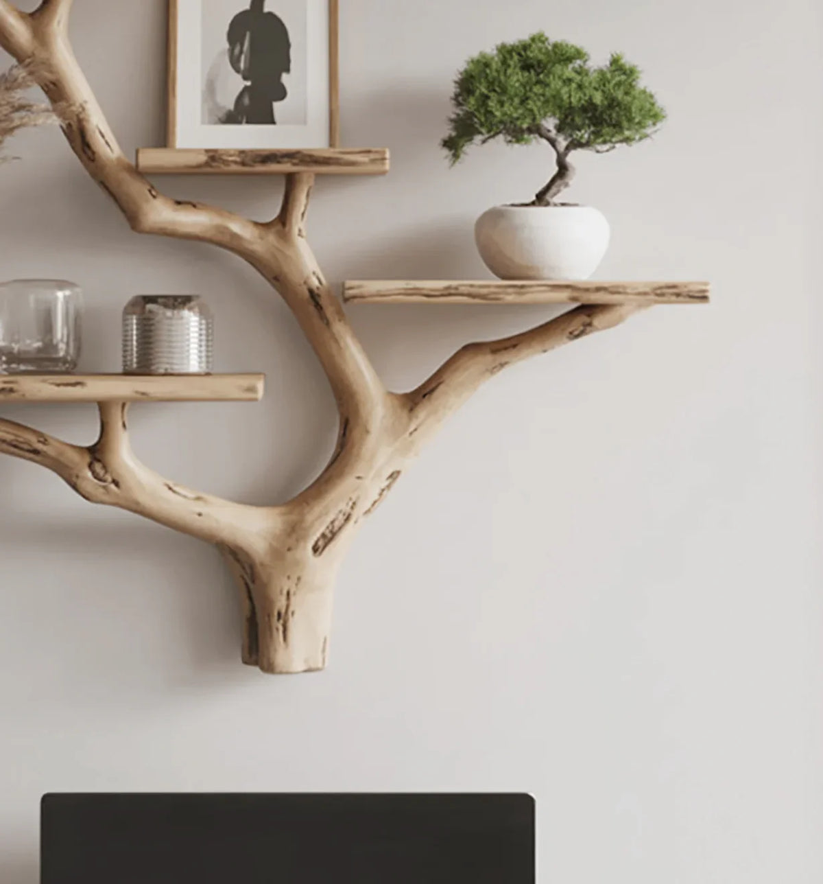 Live edge tree bookshelf with floating wooden shelves and decor on a wall