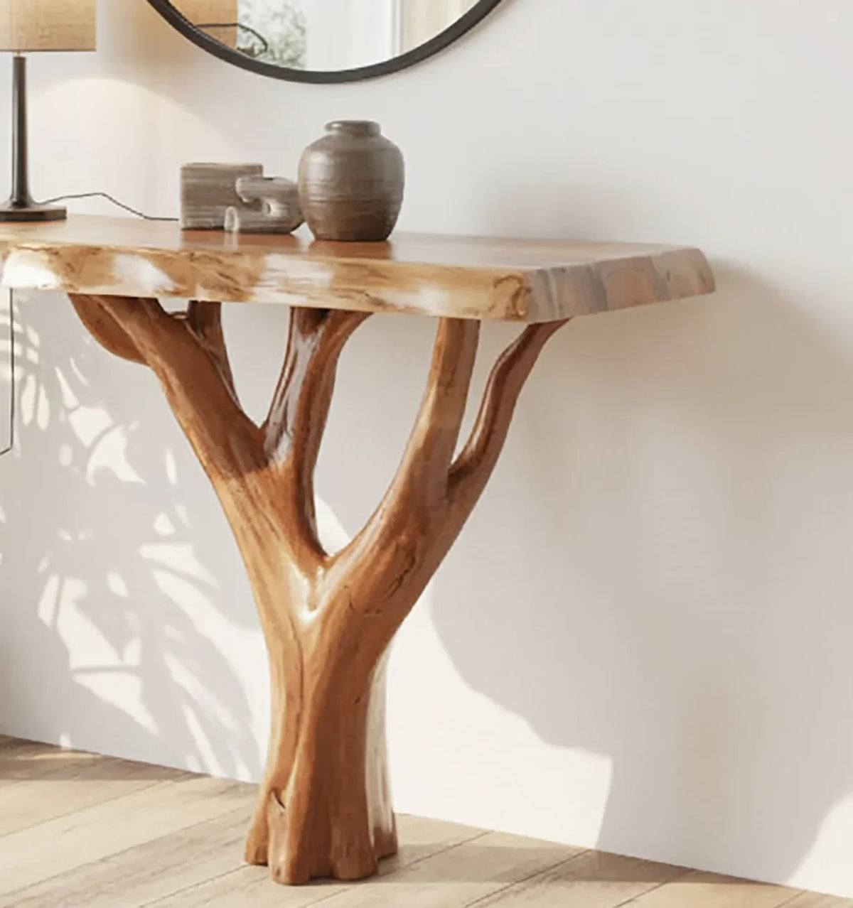 Live edge solid wood console table with tree-shaped base in modern room