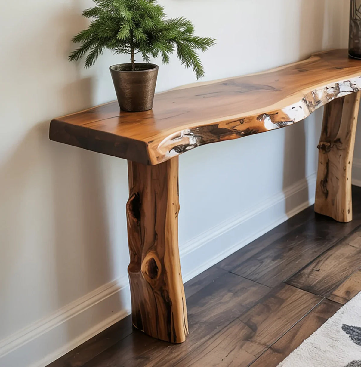 Live edge solid wood console table with natural finish and potted plant on top
