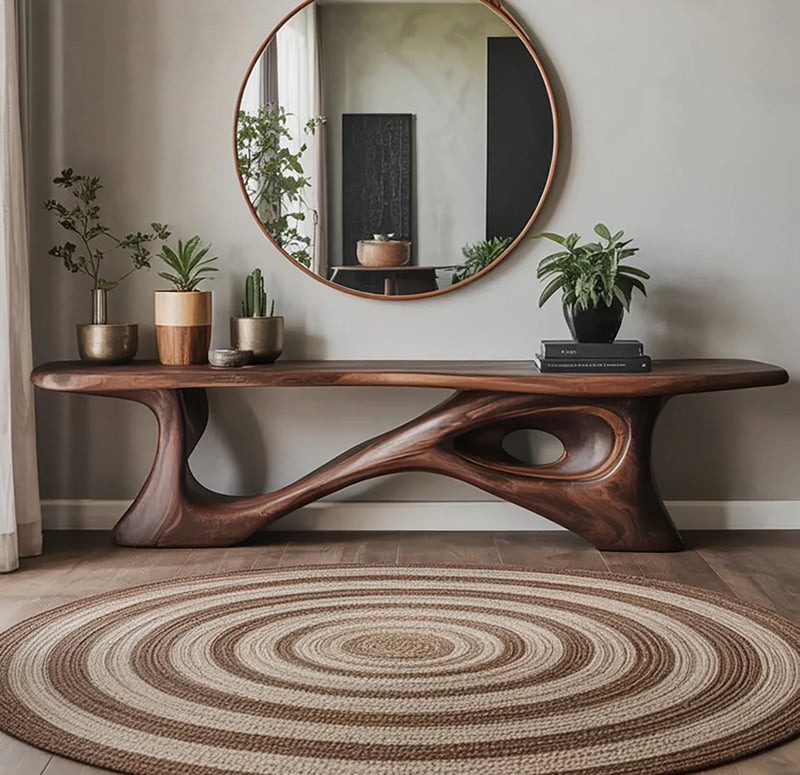 Sculptural solid wood bench in modern living room with round mirror, plants, and circular rug