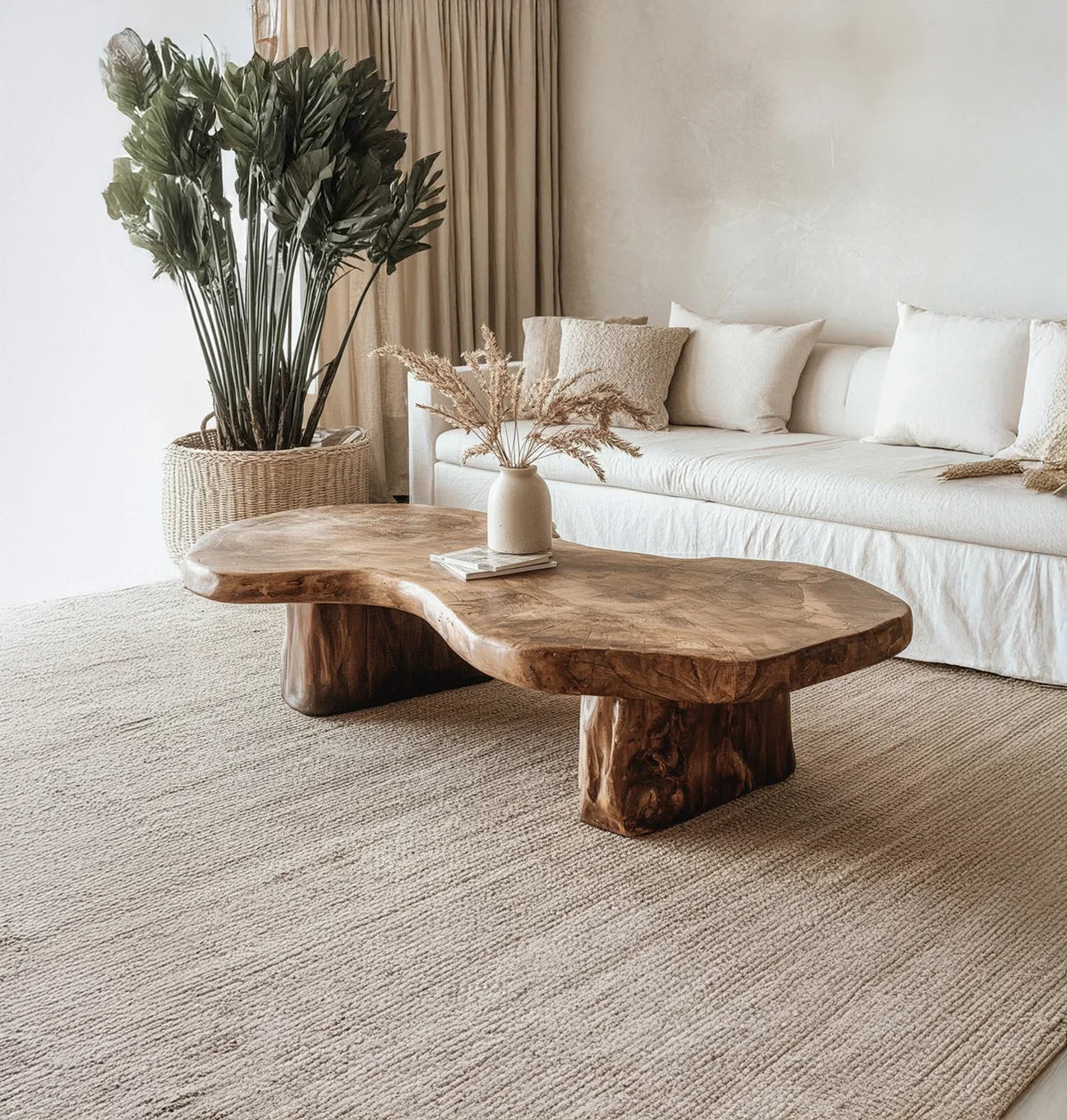 Live edge solid wood coffee table in modern neutral living room with sofa and plant