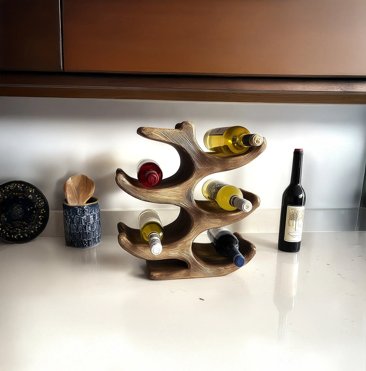 Modern wooden wine rack holding assorted wine bottles on a kitchen countertop
