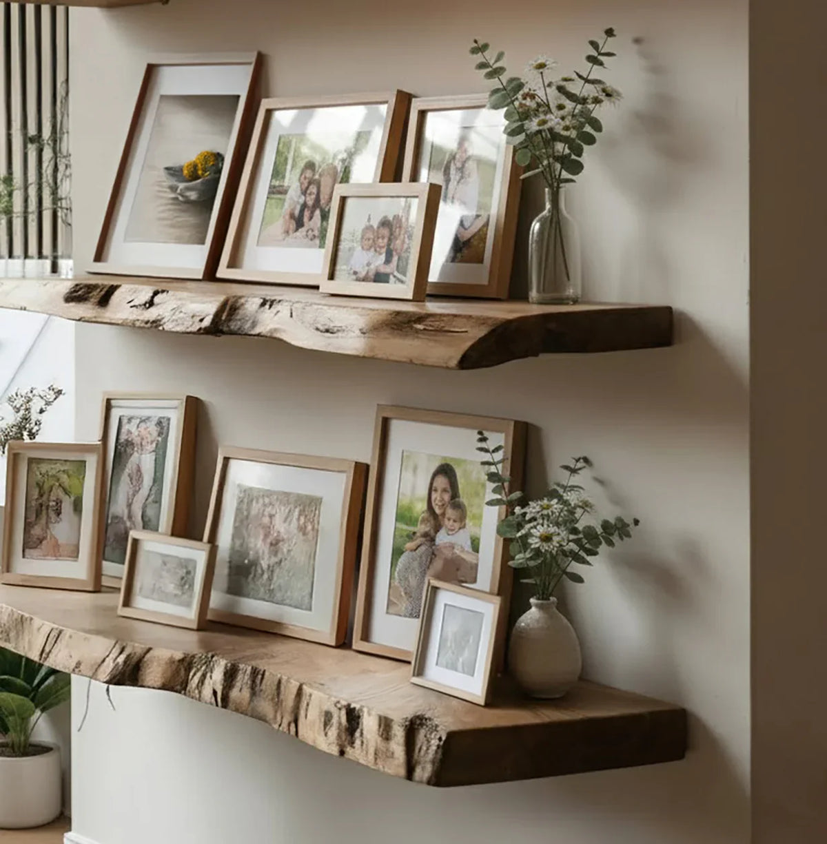 Rustic wooden shelves with family photo frames and vases with flowers in cozy home decor