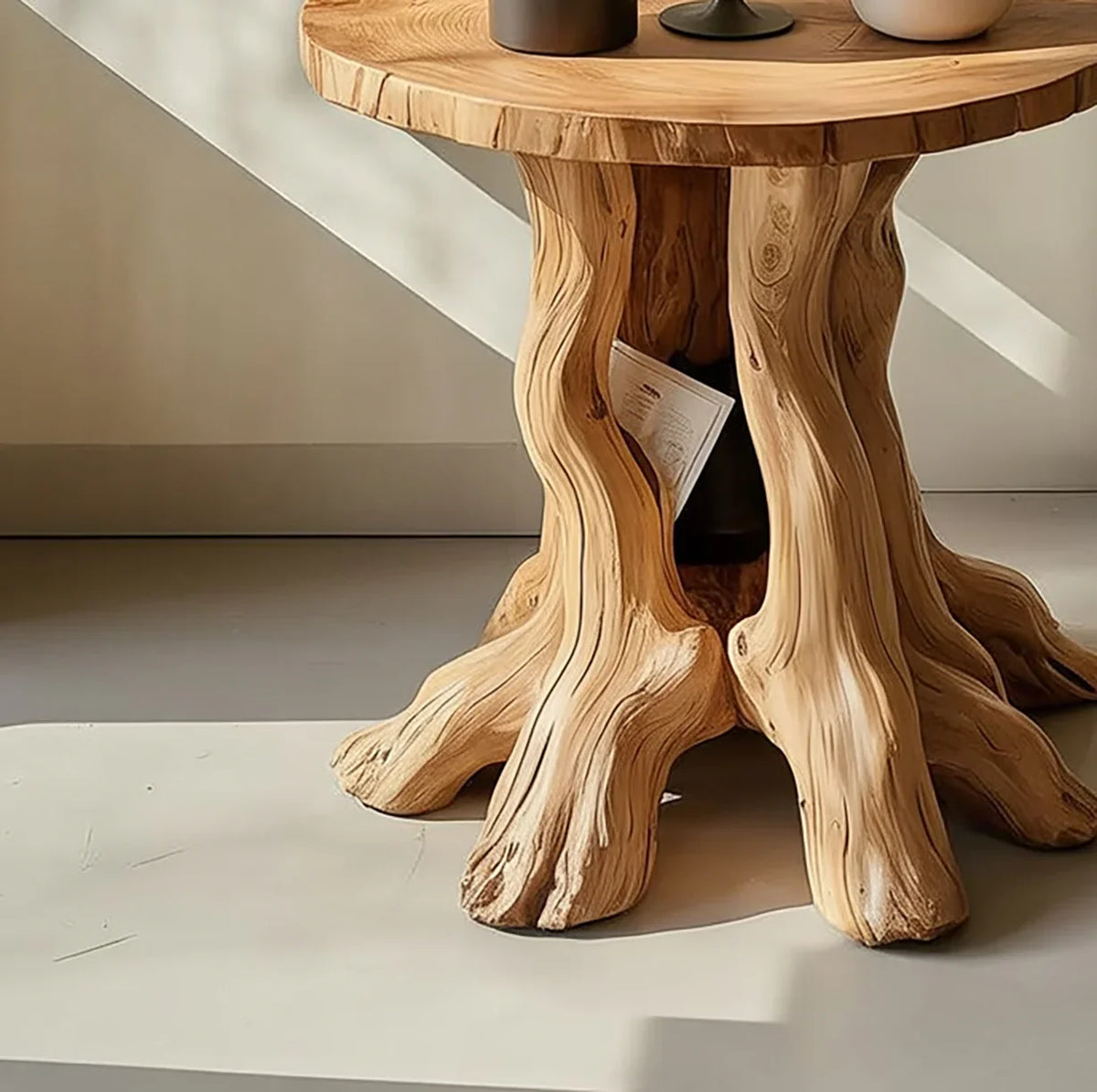 Live edge wood side table with sculpted tree root base in natural light