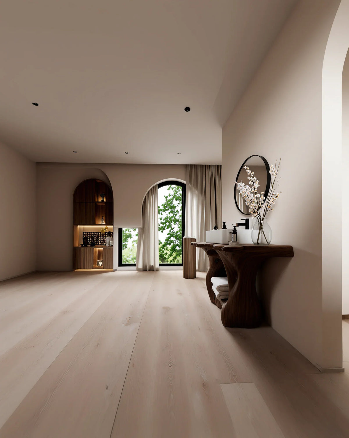 Modern living space with light wood flooring, live edge wood vanity, round mirror, and built-in shelves.