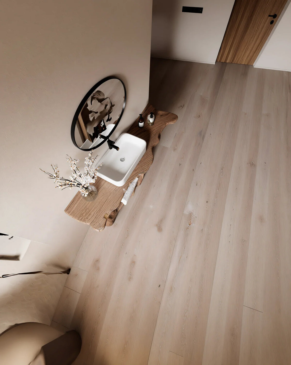 Modern bathroom with live edge wood vanity, vessel sink, round mirror, and light wood flooring