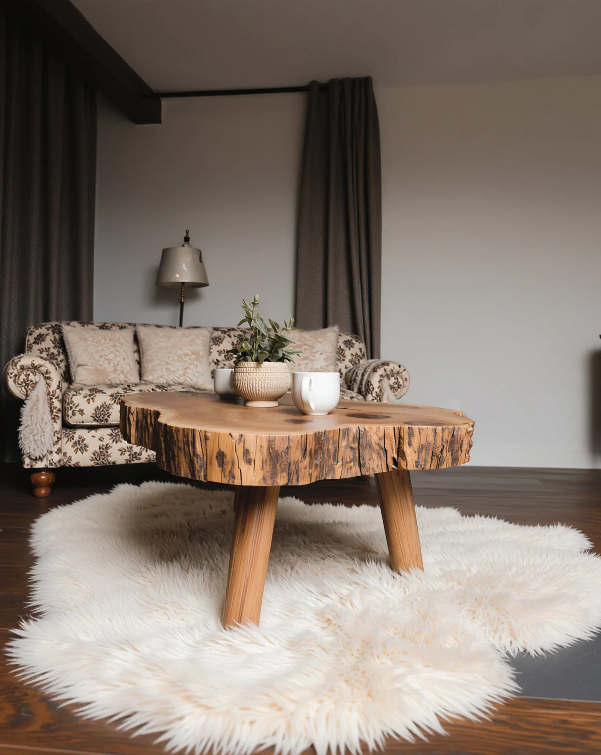 Live edge solid wood coffee table on faux fur rug in cozy living room with sofa and lamp