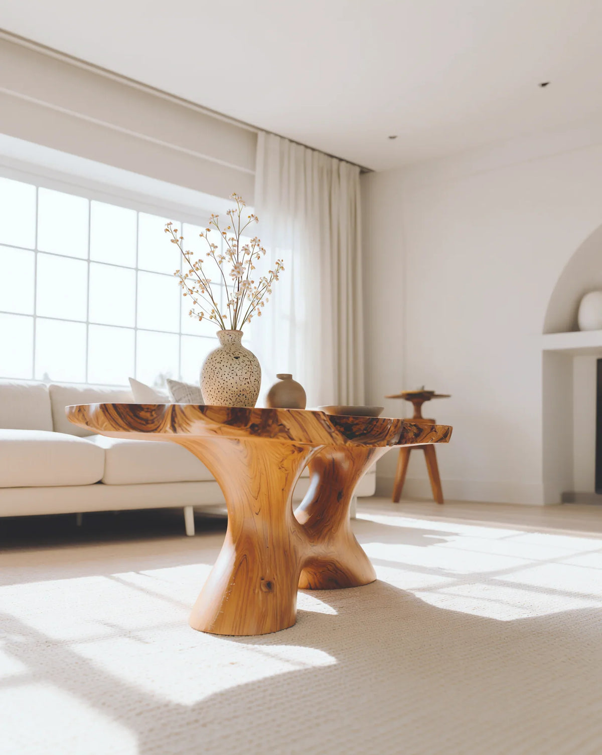 Sustainably crafted live edge solid wood coffee table in a bright modern living room