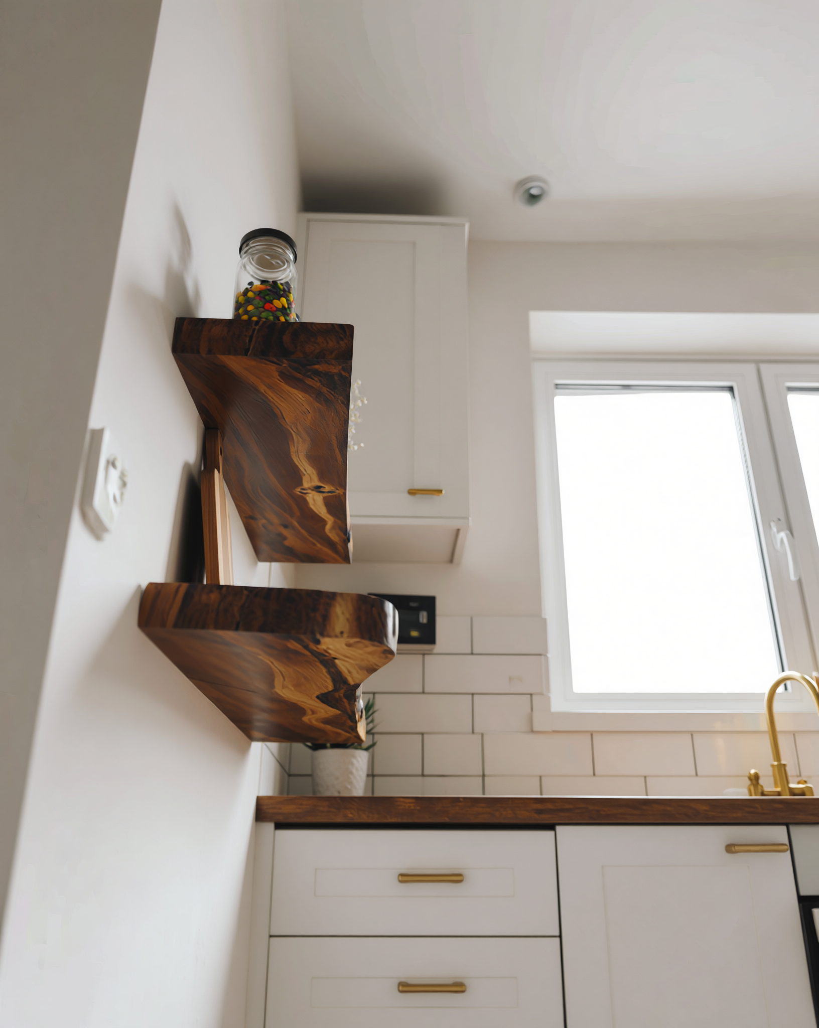 Modern kitchen with live edge solid wood floating shelves on a white tiled wall.